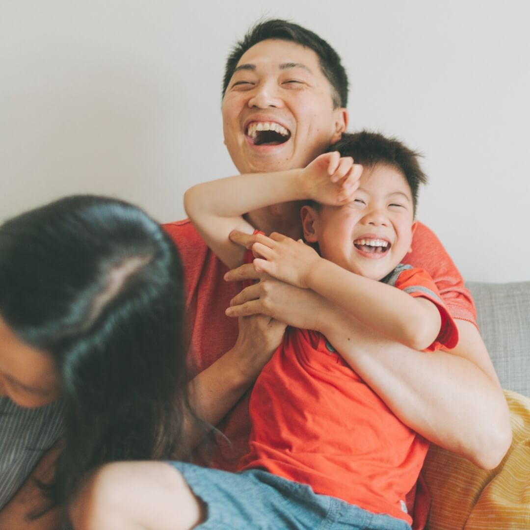 Happy family embracing at home, relieved after securing a bad credit personal loan with BrightCredit. Flexible & fast loan options available.