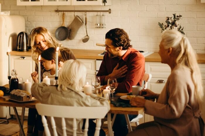Multi-generational family sharing a meal together at home